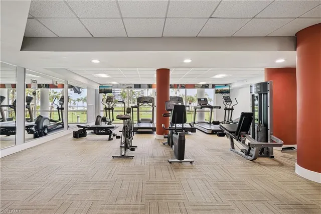 a room with furniture and gym equipment