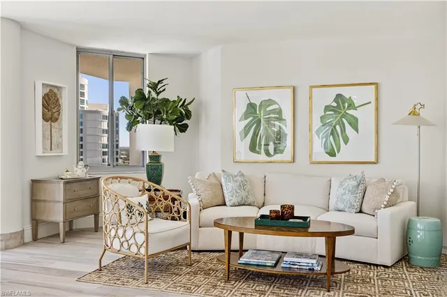 a living room with furniture and a potted plant