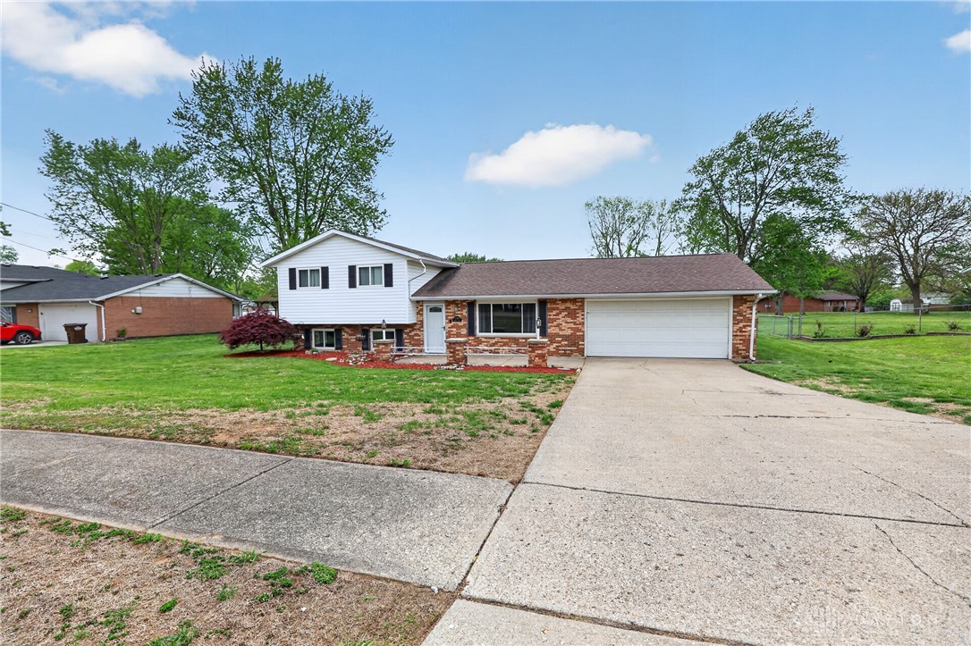5741 Gray Road Fairfield, OH 45014 - Photo 28 of 32 This classic split-level residence features a two-car garage and a neatly maintained front yard.