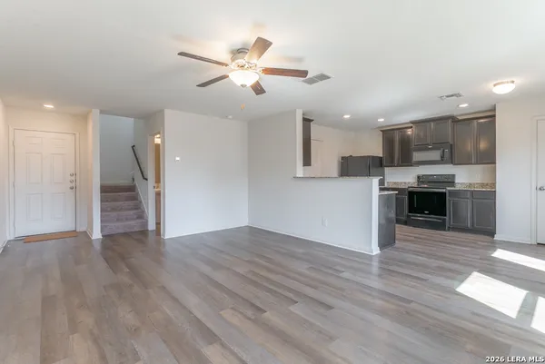 a view of a kitchen with a sink and a window