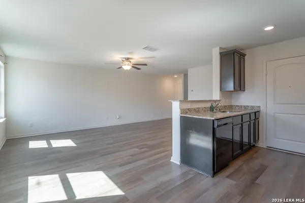 a kitchen with a sink stove and refrigerator