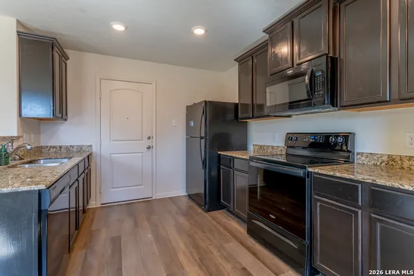 a bathroom with a sink toilet and a mirror