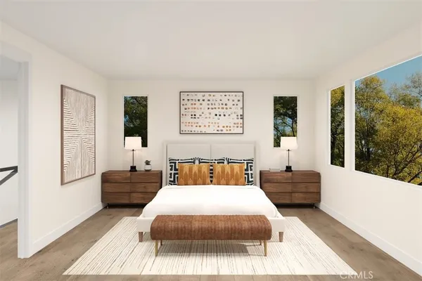 a bedroom with a large bed and a couch