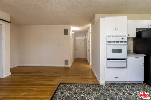 a view of kitchen with wooden floor