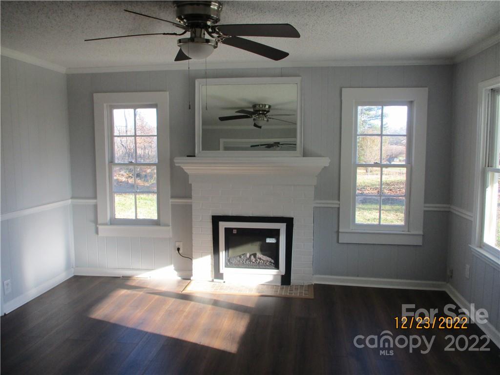 330 Ike Lynch Road Dallas, NC 28034 - Photo 3 of 28 an empty room with windows and fireplace