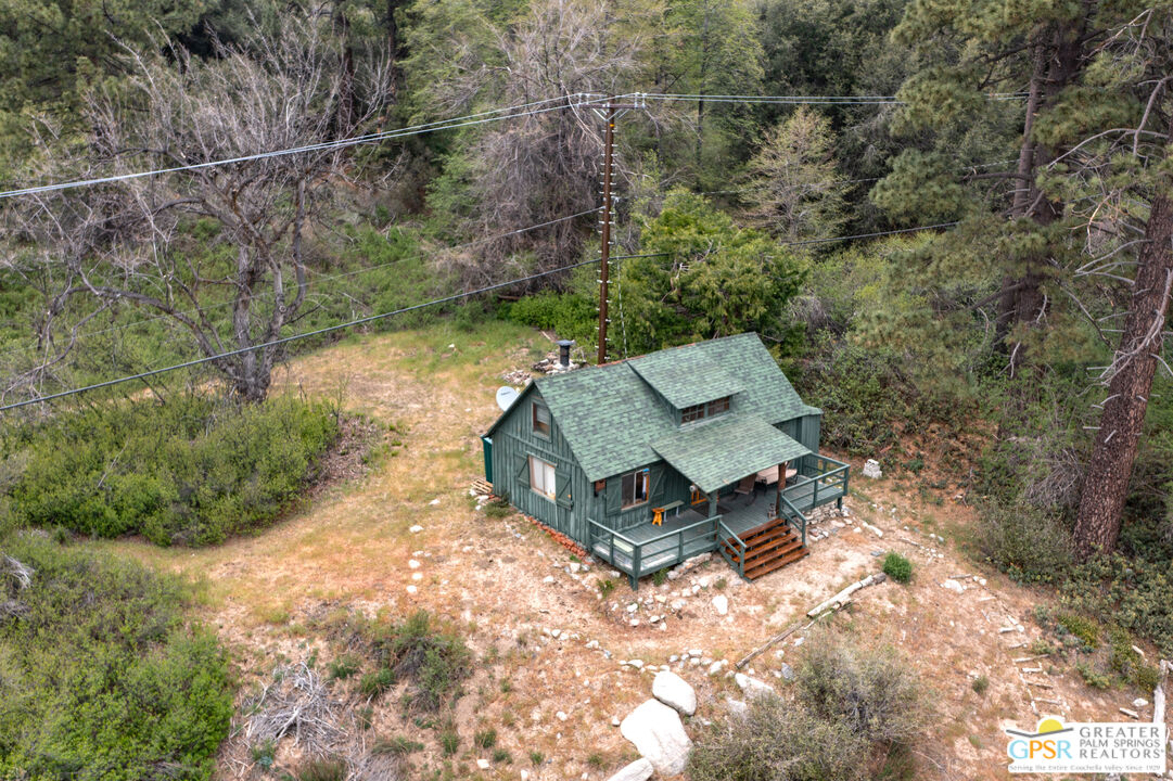 69 7 Oaks Road Angelus Oaks, CA 92305 - Photo 30 of 36 an aerial view of a house with yard and outdoor seating