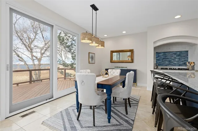 a view of a dining room with furniture window and outside view