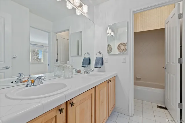 a bathroom with a sink a vanity and a mirror
