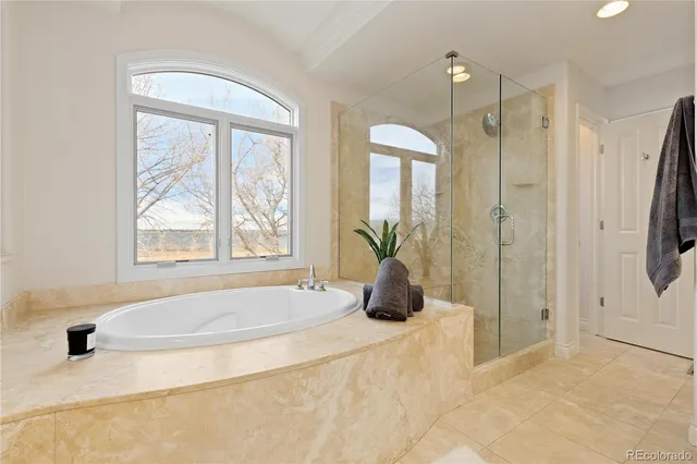 a view of an empty room with a window and cabinet