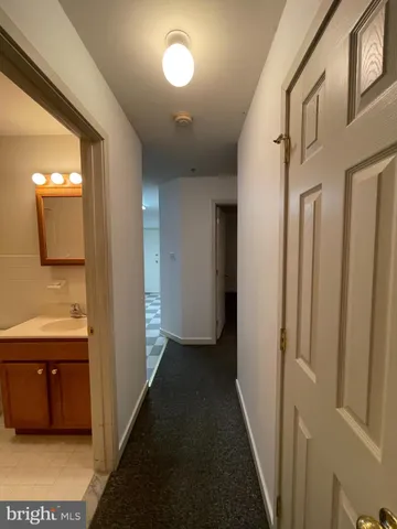 a view of a bathroom from the hallway