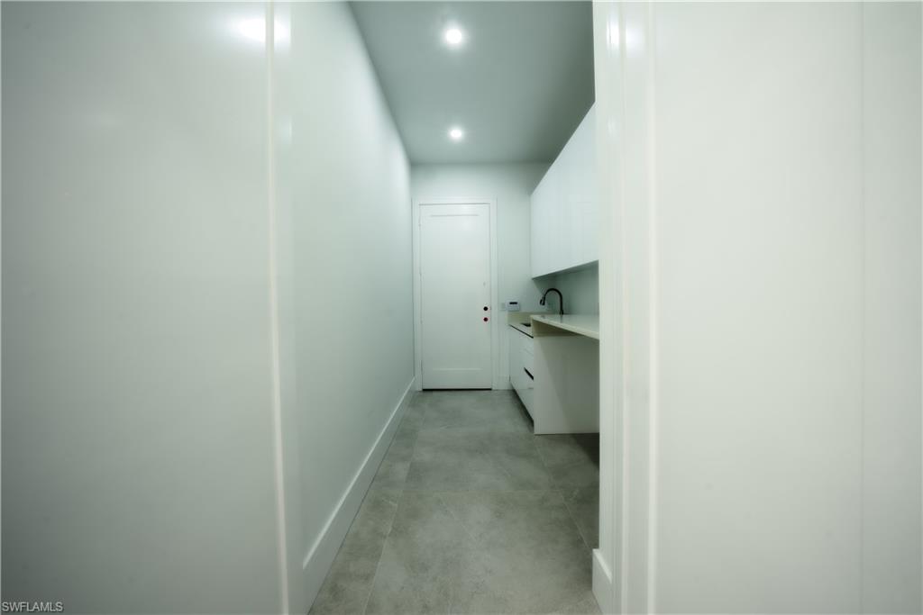 522 17th Street Southwest Naples, FL 34117 - Photo 10 of 48 a view of a hallway with a bathroom