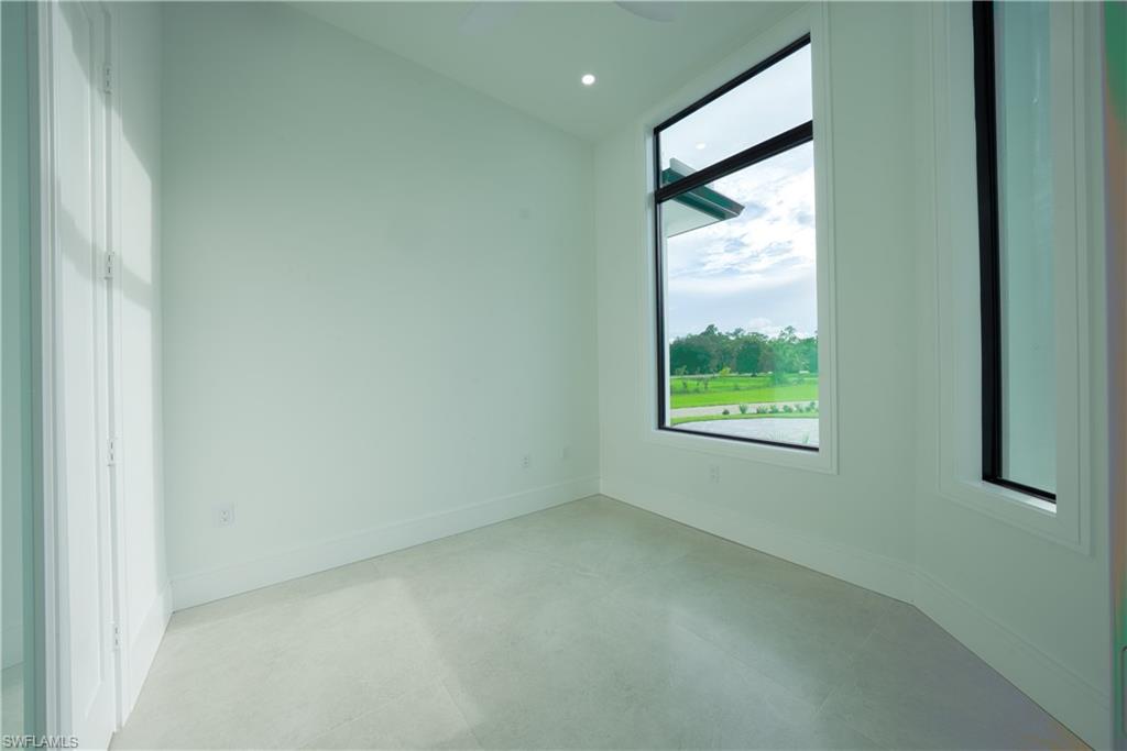 522 17th Street Southwest Naples, FL 34117 - Photo 12 of 48 a view of an empty room with a window