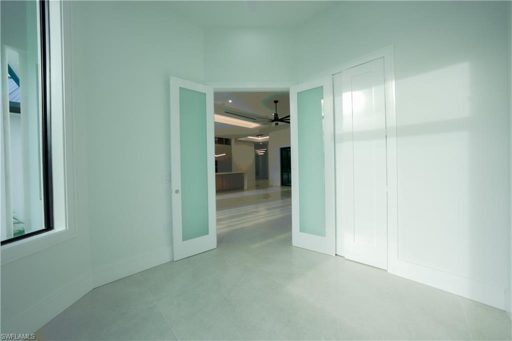 522 17th Street Southwest Naples, FL 34117 - Photo 13 of 48 a view of a hallway with wooden shelves