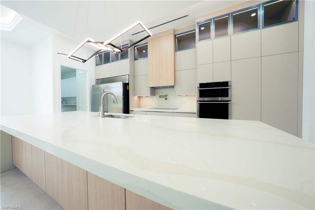 522 17th Street Southwest Naples, FL 34117 - Photo 25 of 48 a bathroom with a sink and a mirror