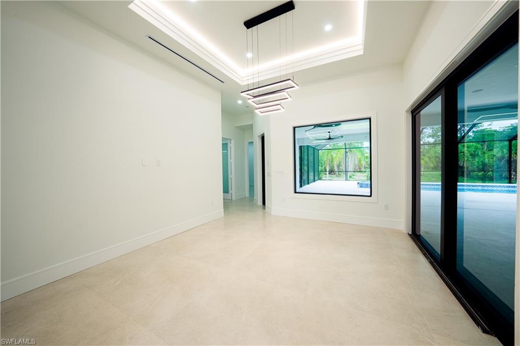 522 17th Street Southwest Naples, FL 34117 - Photo 26 of 48 an empty room with windows and entrance