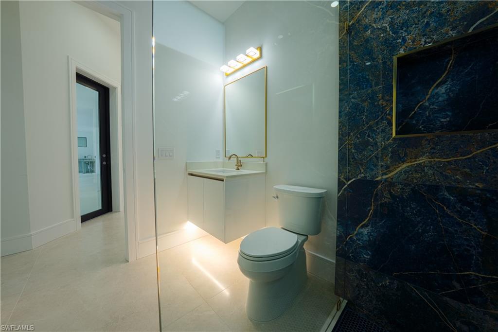 522 17th Street Southwest Naples, FL 34117 - Photo 29 of 48 a bathroom with a toilet and a shower