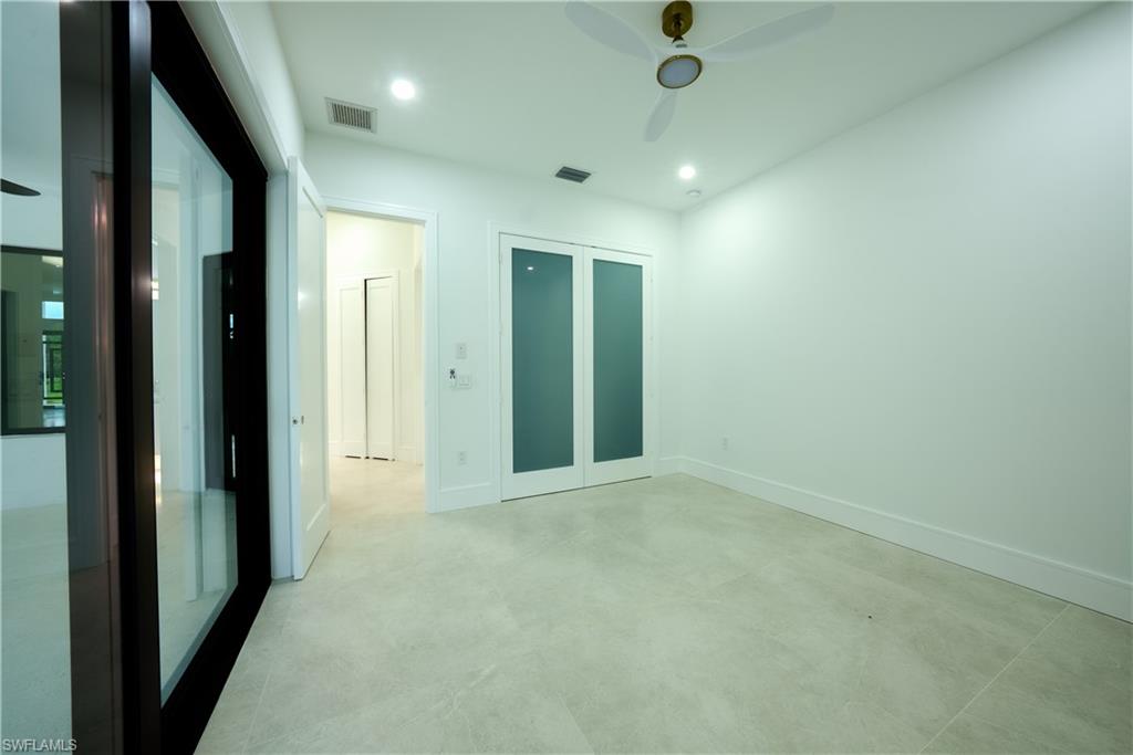 522 17th Street Southwest Naples, FL 34117 - Photo 31 of 48 an empty room with closet and entryway