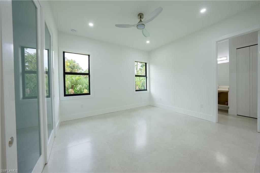 522 17th Street Southwest Naples, FL 34117 - Photo 33 of 48 an empty room with windows and closet