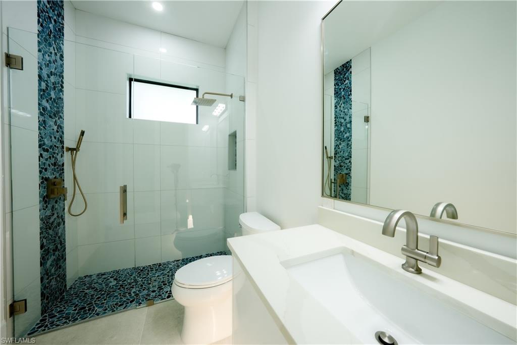 522 17th Street Southwest Naples, FL 34117 - Photo 34 of 48 a bathroom with a sink a toilet and shower