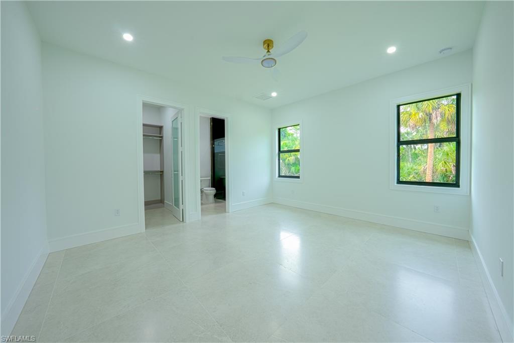 522 17th Street Southwest Naples, FL 34117 - Photo 37 of 48 an empty room with windows and closet