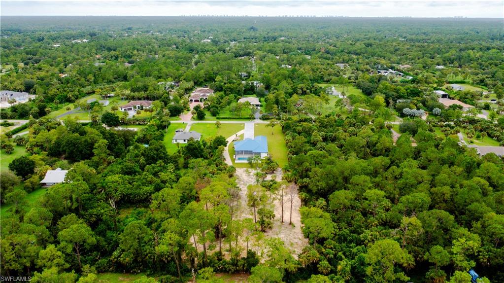 522 17th Street Southwest Naples, FL 34117 - Photo 4 of 48 a view of a forest with a street