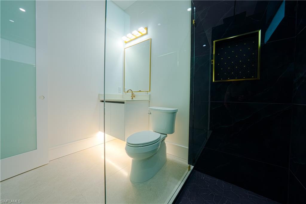 522 17th Street Southwest Naples, FL 34117 - Photo 40 of 48 a bathroom with a toilet and a shower