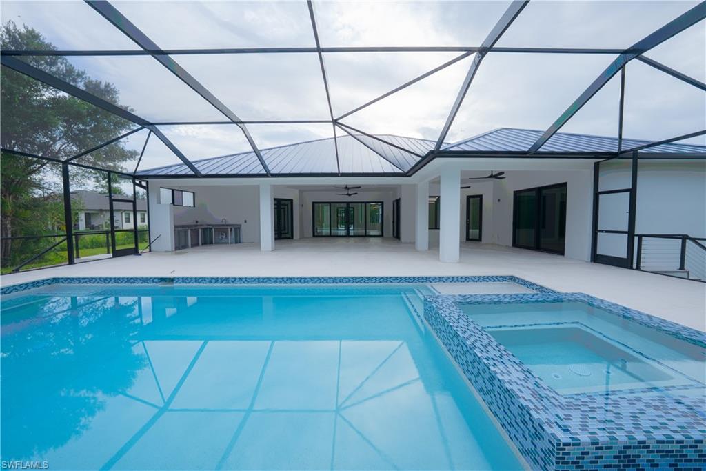 522 17th Street Southwest Naples, FL 34117 - Photo 44 of 48 a view of a porch with a table and chairs
