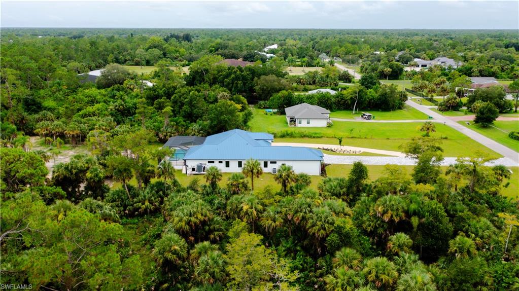 522 17th Street Southwest Naples, FL 34117 - Photo 5 of 48 an aerial view of a house with a yard swimming pool outdoor seating and yard