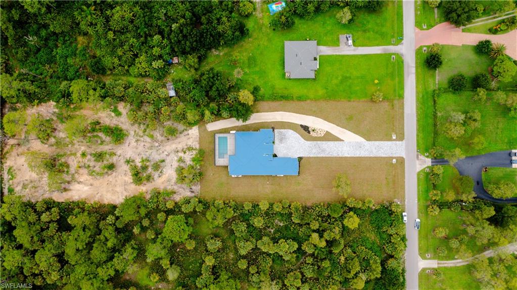 522 17th Street Southwest Naples, FL 34117 - Photo 6 of 48 an aerial view of a house with a yard