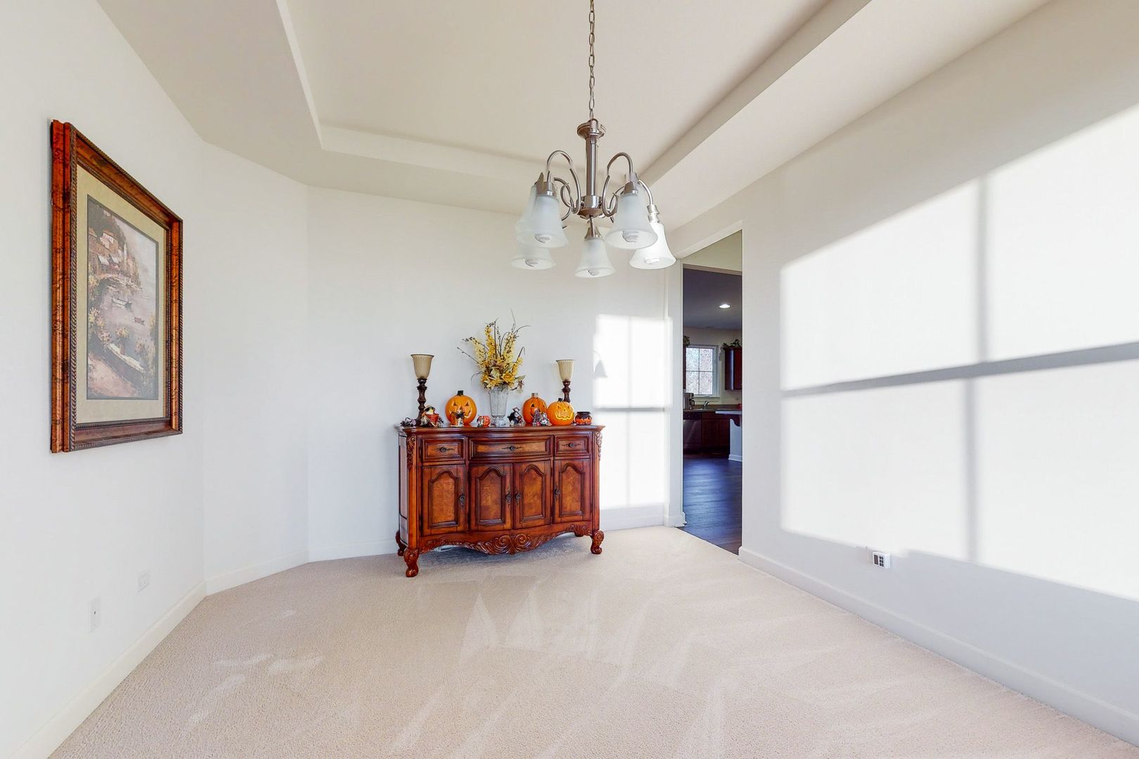 4362 Rudyard Kipling Road Elgin, IL 60124 - Photo 11 of 33 a view of a chandelier in big room and chandelier fan