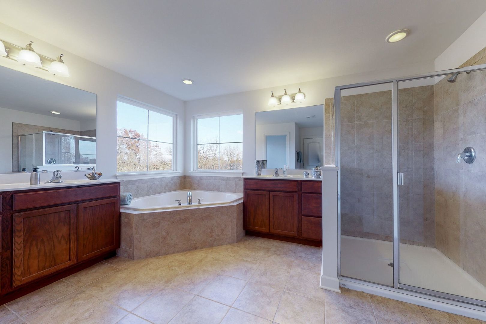 4362 Rudyard Kipling Road Elgin, IL 60124 - Photo 21 of 33 a large spacious bathroom with a tub shower sink and mirror
