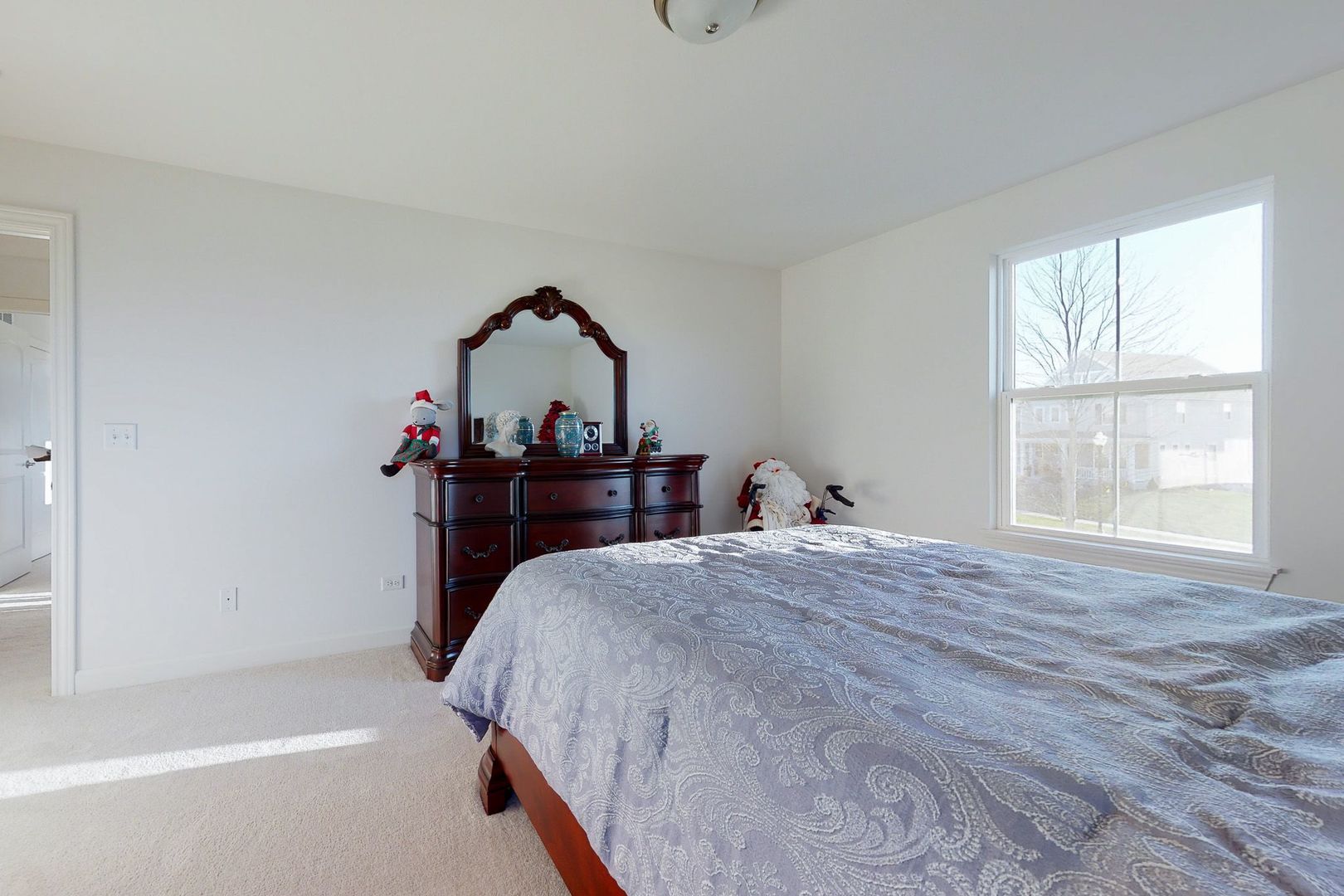 4362 Rudyard Kipling Road Elgin, IL 60124 - Photo 24 of 33 a bed sitting in a bedroom next to a window