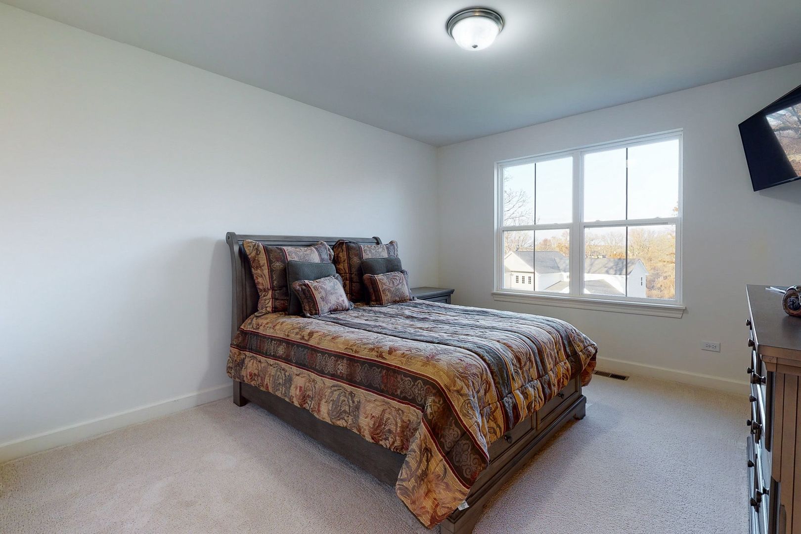 4362 Rudyard Kipling Road Elgin, IL 60124 - Photo 25 of 33 a bed sitting in a bedroom next to a window