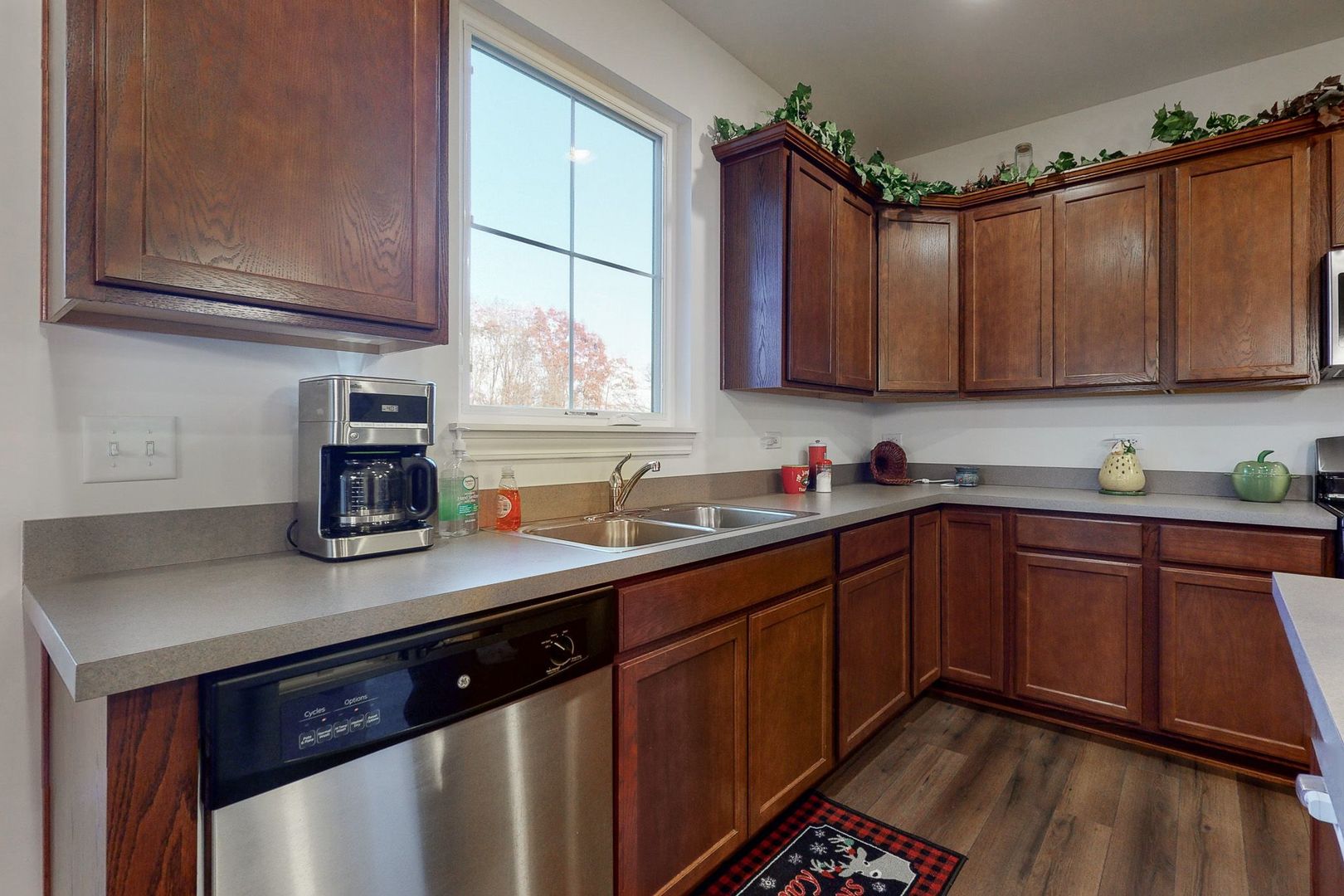 4362 Rudyard Kipling Road Elgin, IL 60124 - Photo 7 of 33 a kitchen with stainless steel appliances granite countertop a sink stove and cabinets