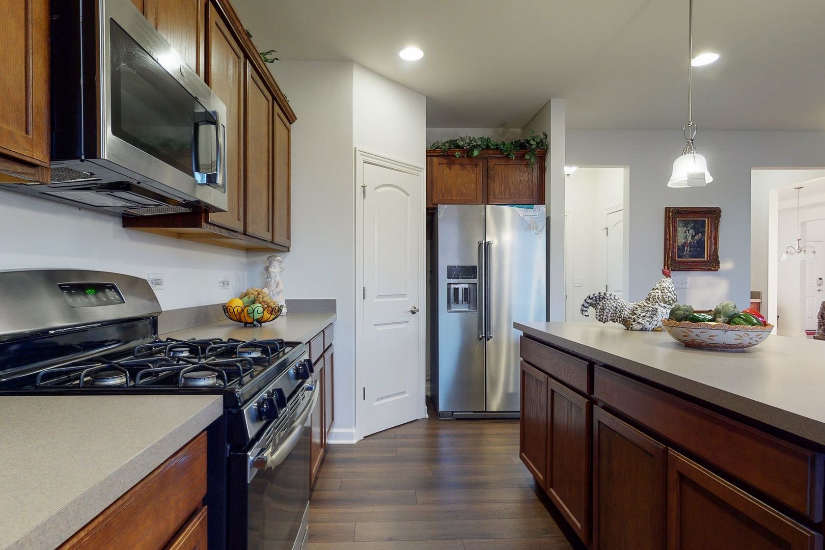 4362 Rudyard Kipling Road Elgin, IL 60124 - Photo 8 of 33 a kitchen with stainless steel appliances a sink stove and refrigerator
