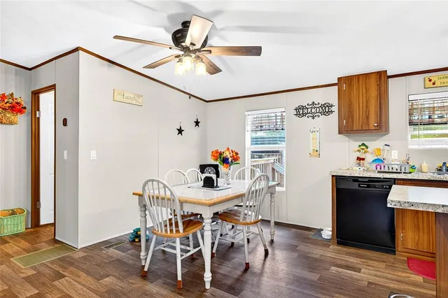 a bedroom with a bed and a flat tv screen on dresser