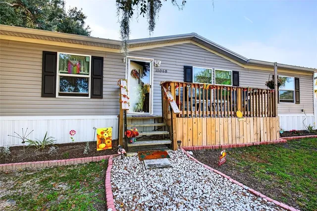 a house view with a sitting space and garden space