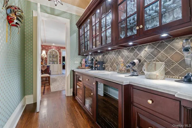 a kitchen with stainless steel appliances granite countertop a lot of counter space and wooden floor
