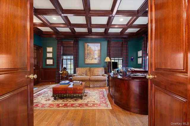 a living room with furniture windows and wooden floor