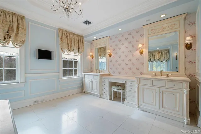 a spacious bathroom with a sink a mirror and a bathtub