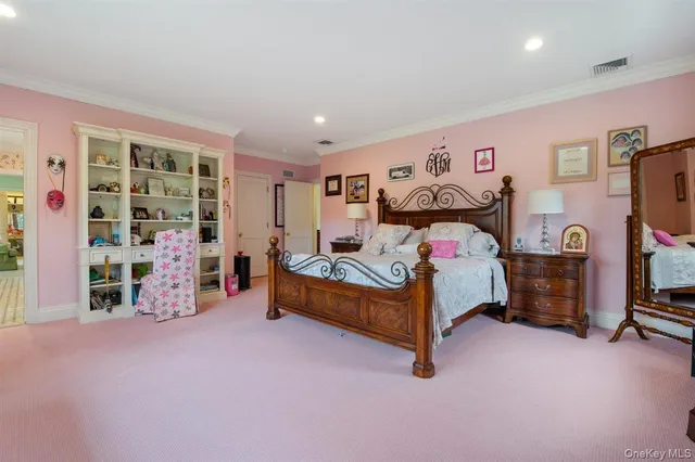 a bedroom with a bed and a tv