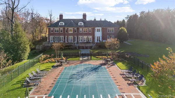 a view of a swimming pool with a patio