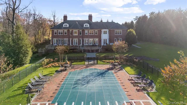 a view of a swimming pool with a patio