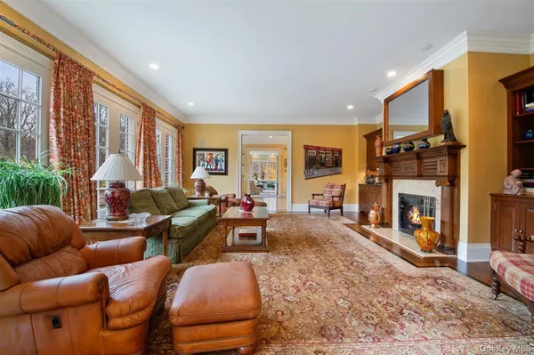 a living room with furniture fireplace and flat screen tv
