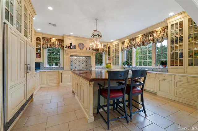 a large kitchen with a table and chairs