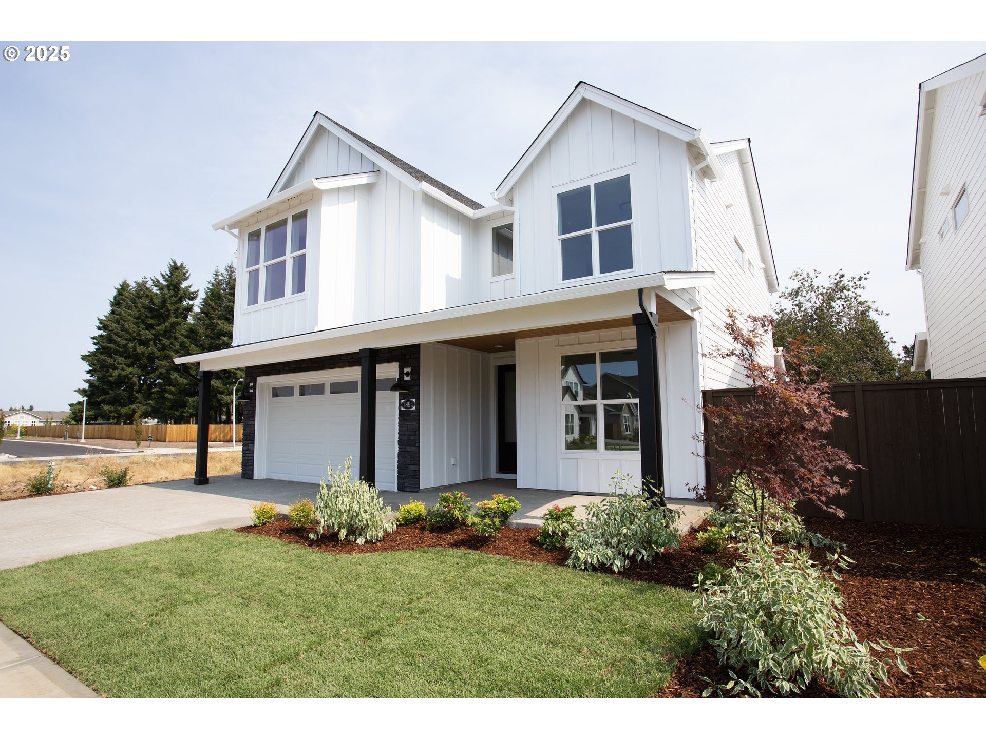 1896 South Holly Street Canby, OR 97013 - Photo 1 of 36 a front view of house with a garden
