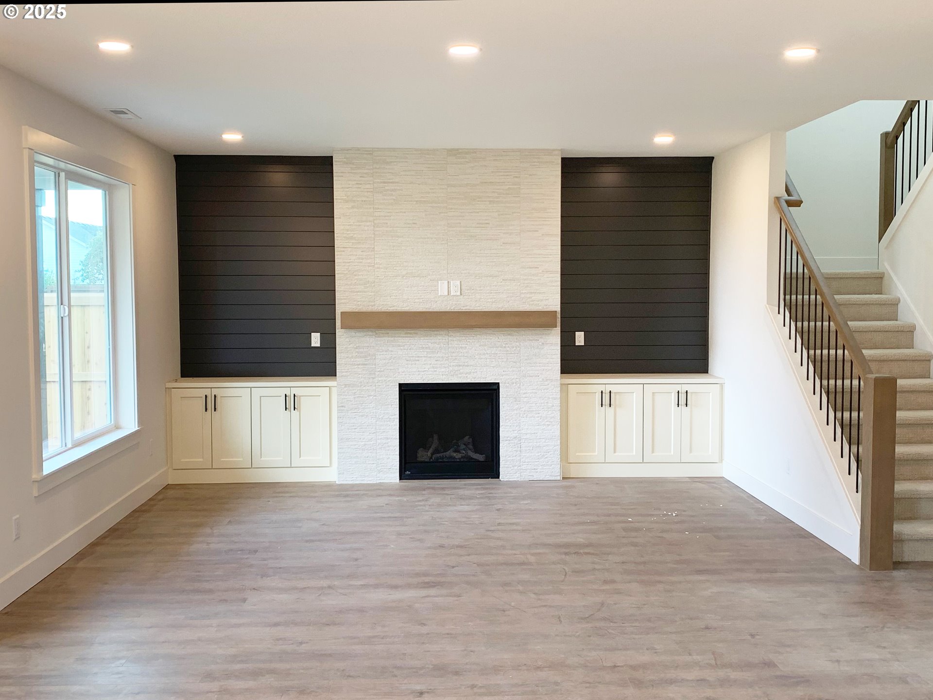 1896 South Holly Street Canby, OR 97013 - Photo 11 of 36 an empty room with windows and a fireplace