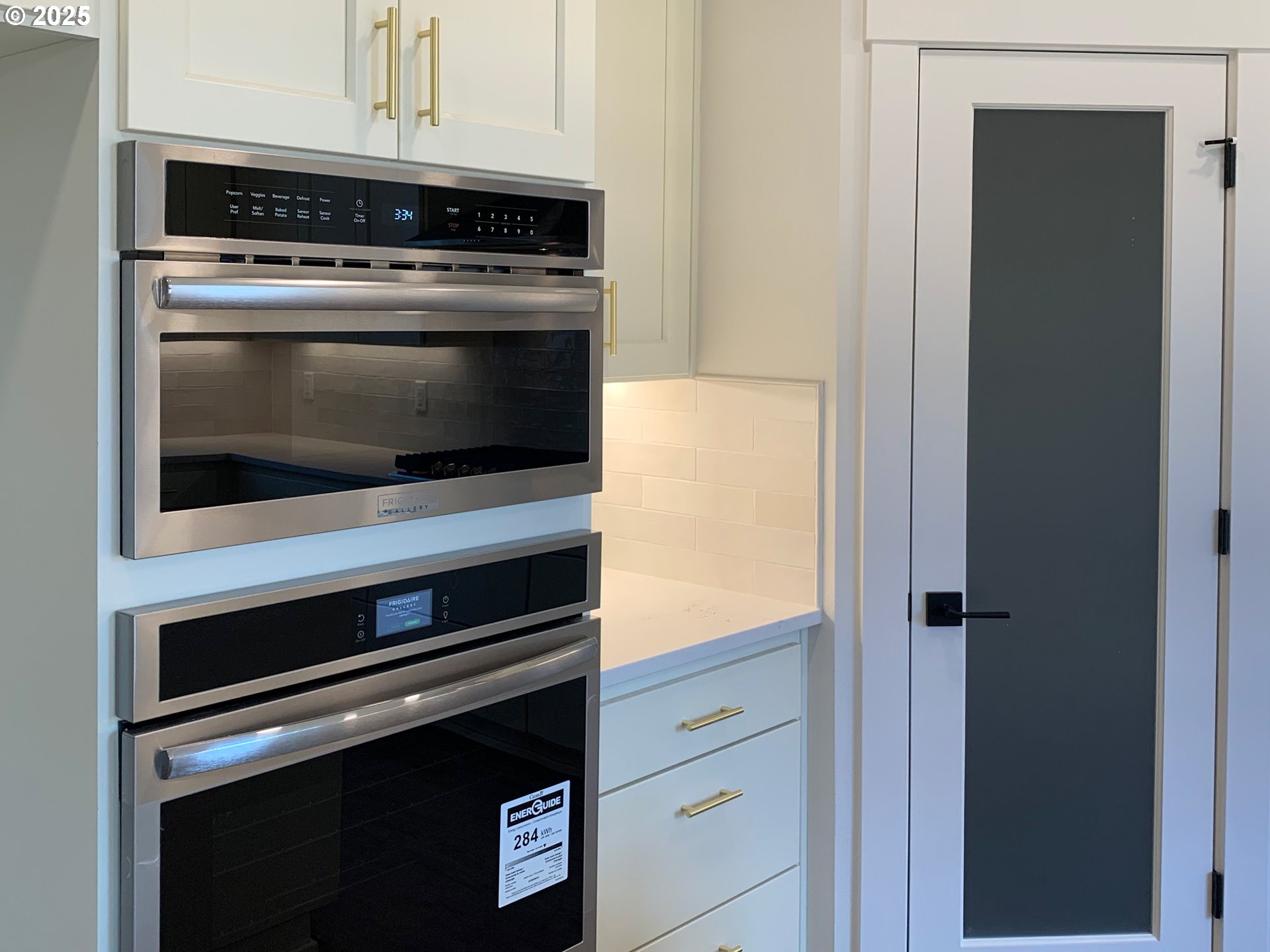 1896 South Holly Street Canby, OR 97013 - Photo 16 of 36 a stove top oven sitting inside of a kitchen