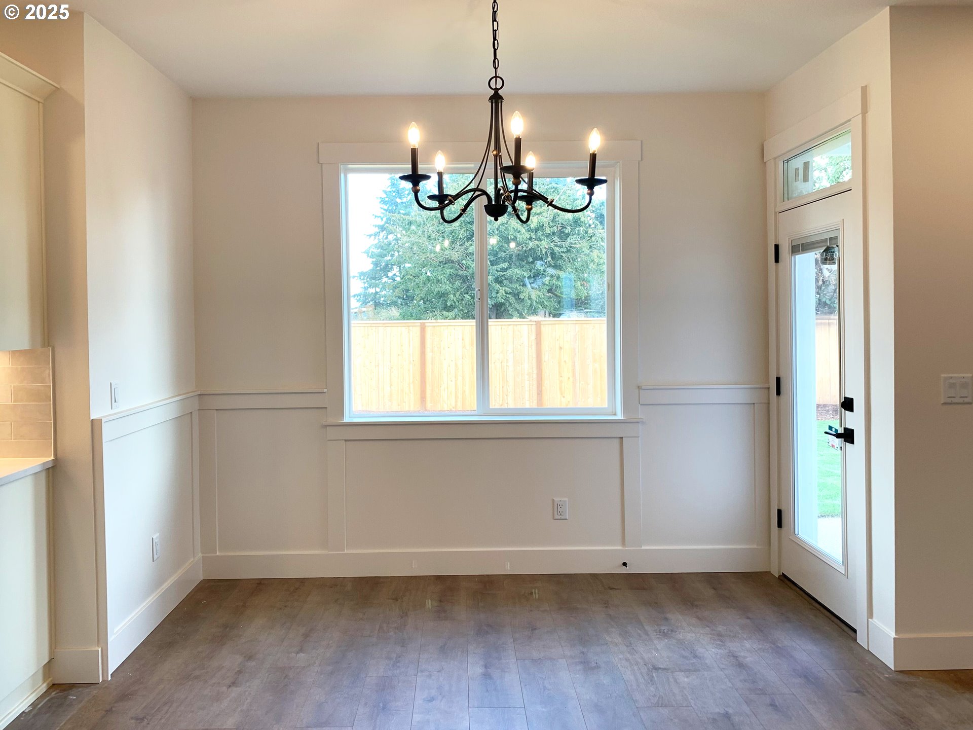1896 South Holly Street Canby, OR 97013 - Photo 33 of 36 a view of an empty room with chandelier and window
