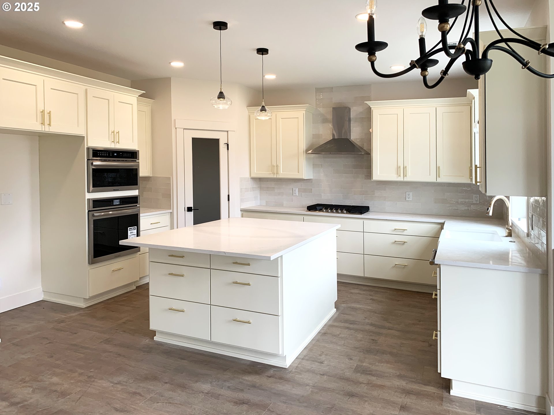1896 South Holly Street Canby, OR 97013 - Photo 4 of 36 a kitchen with kitchen island granite countertop a sink a counter top space stainless steel appliances and cabinets